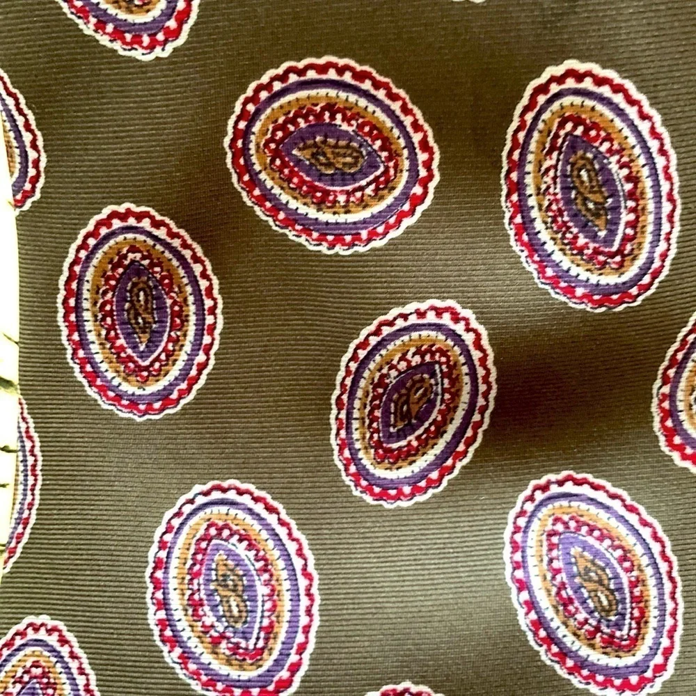 Alexander Cross Ltd Men’s Tie. 100% Silk. Base is Brown with Red & Blue Paisley